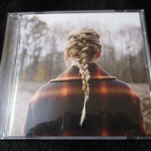 Taylor Swift CD with Blonde Hair and Brown Plaid Jacket Artwork